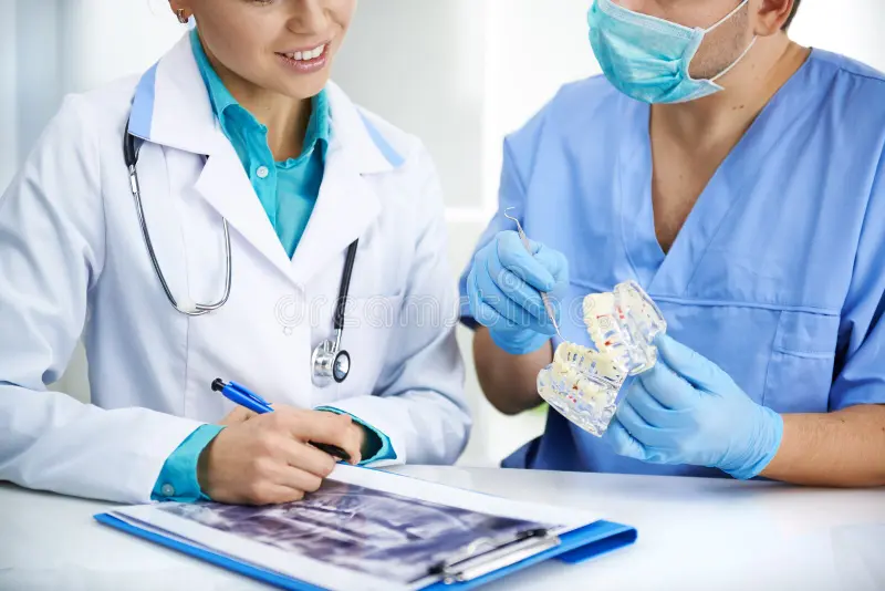 For Healthcare Professionals: Practical Insights for Dentists, Doctors, Clinics & Hospitals | SkyMedIdent dentists meeting medical colleagues discussing teeth problems dental clinic young professional doctors studying jaw ray 62382915
